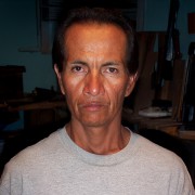 Sour-looking man with short dark hair